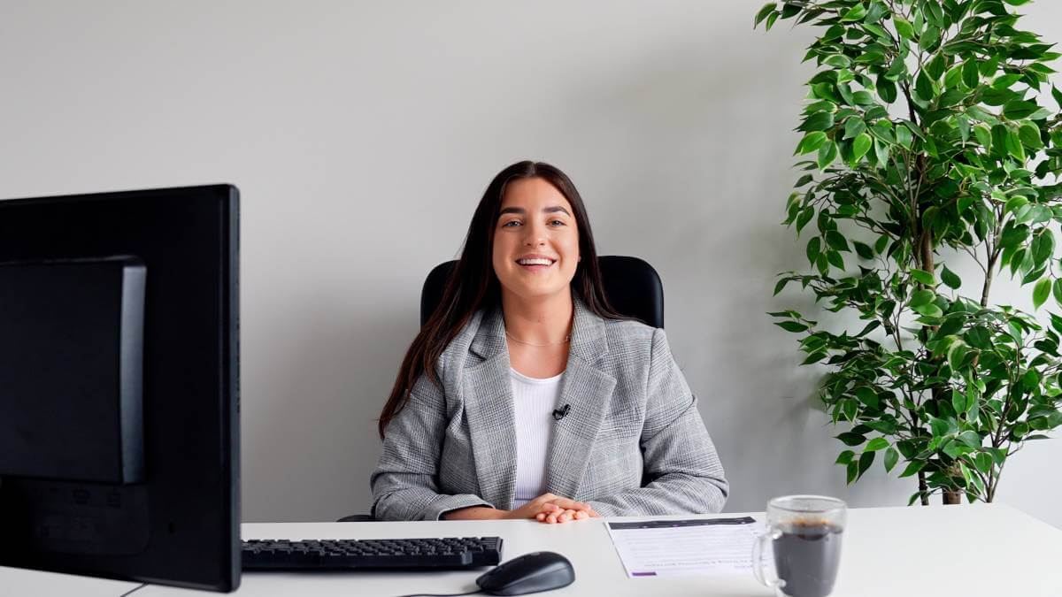 Katie Sitting At Her Desk